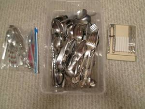 Assortment of silverware along with...