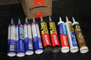 lot 183 image: Lot of (9) Assorted Sealants and Adhesives - Tub & Tile, All-Purpose, Gutter and Flash Seal