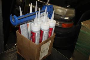 lot 185 image: (8) Assorted Sealants and Adhesives, (1) Sealant Gun