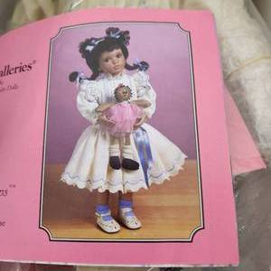 lot 48 image: NIB Paradise Galleries Tyra Porcelain Doll With Stuffed Doll