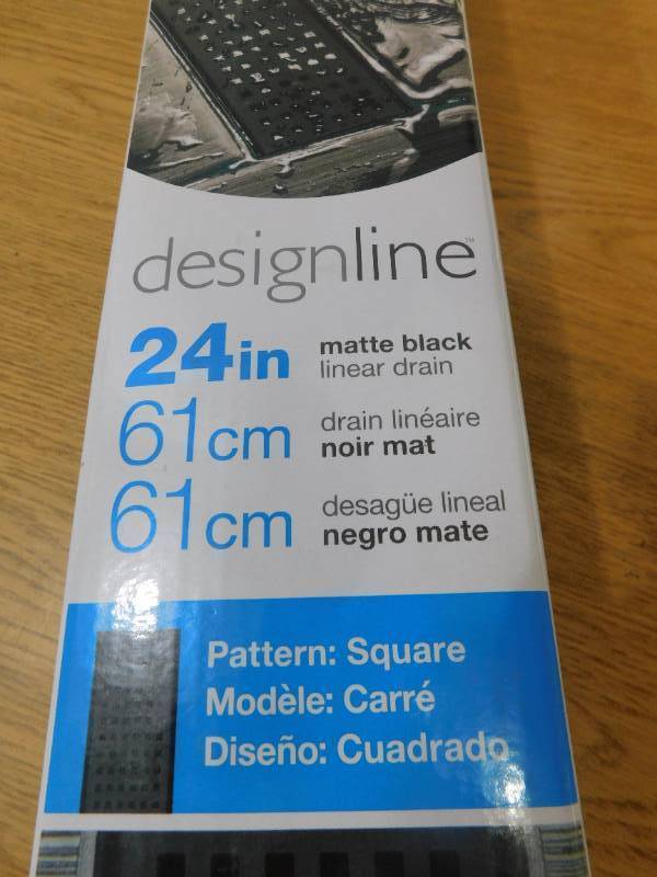lot 48 image: Designline 24 in. Stainless Steel Linear Shower Drain with Square Pattern Drain Cover in Matte Black