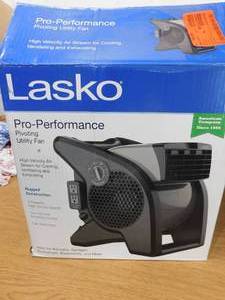 lot 33 image: New Lasko 11.2 in. 3 Speeds Blower Fan in Gray with Carry Handle, Circuit Breaker, Power Outlets, High Velocity Utility Pivoting