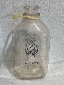lot 25 image: Antique Voegels Glass Milk Container