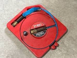 lot 60 image: Toro 50 Foot Hose & Reel