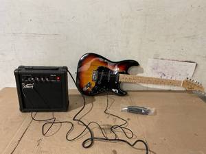 lot 236 image: Glarry GST Electric Guitar w20W Amplifier Sunset