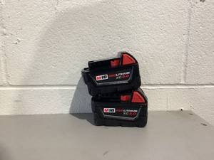 lot 555 image: LOT OF 2 Milwaukee 48-11-1828 3.0 AH Batteries M18 XC Red Lithium 18 Volt