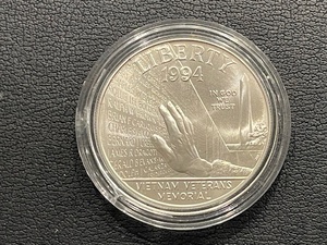 lot 56 image: 1994-W Vietnam Silver Dollar