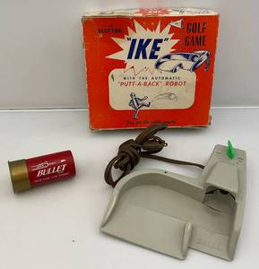 lot 88 image: 1950s Golf Game The Electric IKE With  The Automatic Putt-A-Back Robot In Original Box & Shotgun Shell Golf Ball Holder