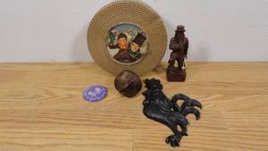 lot 62 image: Tiny Tim Cookie Tin with Wooden Pilgrim, Black Rooster Wall Decor, Large Vintage Bell, and 1986 Last Chance Dance Button