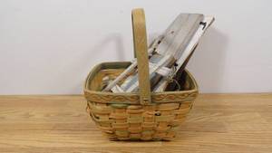 lot 67 image: Medium Wicker Basket with 7 Hand Crafted Wall Decor