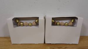 lot 71 image: (Set of 2) 5 Foot Wood Gold Garlands