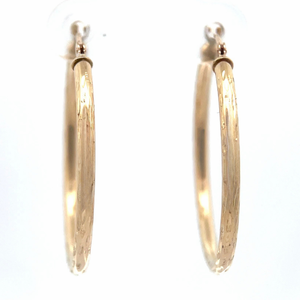 lot 50B image: Brightly Polished Diamond-Cut Tubular Hoop Earrings in Yellow Gold
