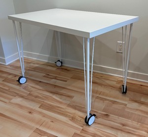 lot 55 image: Linnmon Table by Ikea