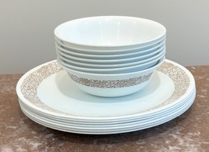 lot 82 image: Seven Corelle Plates and Bowls