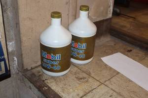lot 446 image: Lot of (2) Mobil Super Motor Oil 10W-40 1-Quart Plastic Bottles