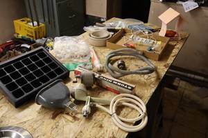 lot 1457 image: Lot of  Assorted Household Goods - Faucet Hose, Storm King Door Closer, Rope (new), Hitch Ball and more