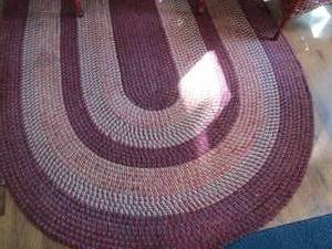 lot 104 image: 8ft red tone oval woven area rug...