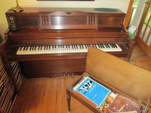 lot 174A image: Everett piano with bench and sheet music
