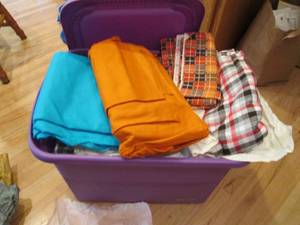 lot 204 image: Covered tote full of assorted fabri...