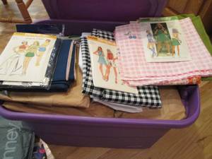 lot 205 image: Covered tote full of fabrics, mater...