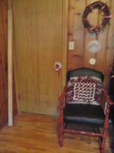 lot 492 image: Black leather chair, pillow, 2 pict...