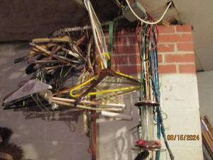 lot 507 image: More items hanging in garage clothe...