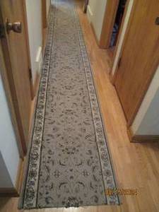 lot 554 image: Long hallway runner 18 feet by 26 i...
