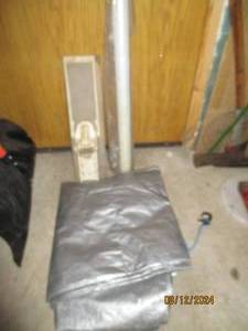 lot 386 image: Can opener, roll of plastic and tarp