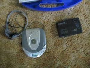 lot 569 image: Portable CD and cassette players along with a case of Christmas cassette tapes