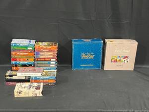 Collection of Trivial Pursuit Board Games and VHS Tapes