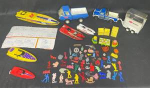 Vintage Toy Lot with Tonka Trucks, Racing Boats, and Assorted Figures