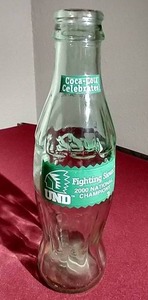 lot 117 image: 2000 UND Fighting Sioux Hockey Championship Coke Bottle