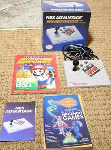 lot 54 image: NES Advantage, Nintendo Power Guide Book,  Complete Guide to Nintendo Games Book Etc
