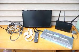 lot 148 image: Insignia LED TV, ASUS Dual Band, Logitech Multi-Device Wireless Keyboard Etc