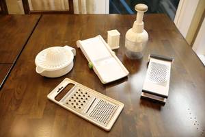 lot 308 image: Kitchen AccessoriesPampered Chef Chopper, Guillotine Slicer, Citrus Juicer, Cheese Grater Etc