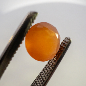 lot 57 image: FIRE OPAL - 0.78ct. Tangerine Orange Round brilliant cut