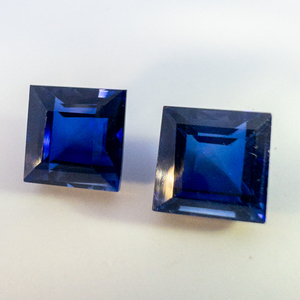 lot 62 image: Pair of LAB GROWN BLUE SAPPHIRE - 12.08ct. Square step cut