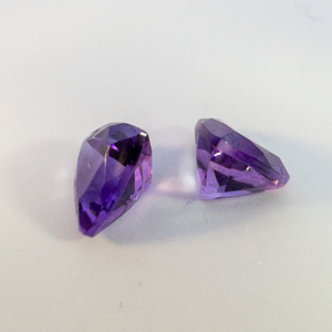 lot 63 image: Pair of AMETHYST - 2.01ct. Trillion cut