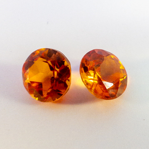 lot 94 image: Pair of LAB GROWN ORANGE SAPPHIRE - 2.06ct. Oval cabochon cut