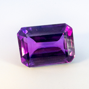 lot 96 image: LAB GROWN PURPLE SAPPHIRE - 11.98ct. Emerald cut