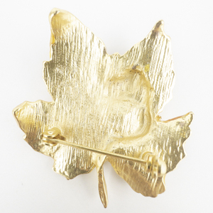 lot 196 image: Catch The Spirit Of Fall - Fall Leaves Yellow Base Metal Brooch. Attached To Original Packaging