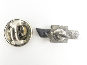 lot 205 image: Chevy White Base Metal Lapel Pin.