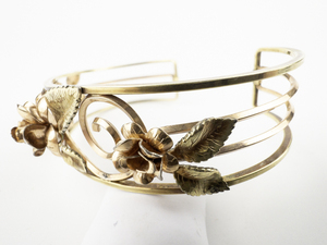 lot 262 image: Krementz Two-Tone Floral Openwork Base Metal Cuff Bracelet.