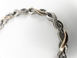 lot 267 image: Rose & White Infinity Sterling Silver & 10K Rose Gold Bracelet.