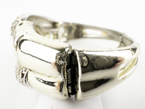 lot 282 image: Interlocking Loop Design Rhinestone Yellow Base Metal Hinged Cuff Bracelet.