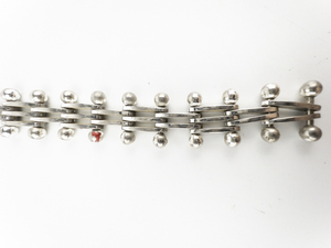 lot 287 image: Unique White Base Metal Bracelet.