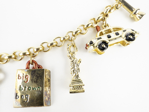 lot 291 image: Bloomingdales I Love NYC Yellow Plated Base Metal Charm Bracelet.