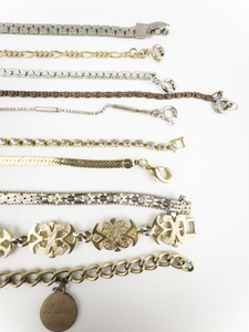lot 294 image: Group of 10 Chain, Herringbone, & Charm base Metal Bracelets.