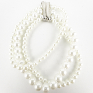 lot 295 image: Rhinestone Accented base Metal Multi-Strand Imitation Pearl Stretch Bracelet .