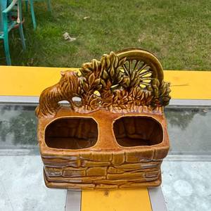 lot 358 image: Vintage McCoy USA Pottery Planter with Spinning Wheel and Dog Design